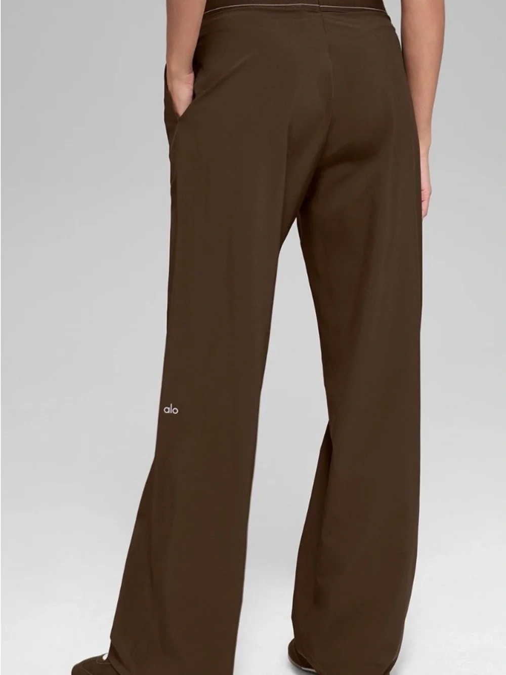 ALO Yoga female, espresso trousers.